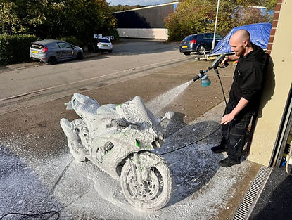 Scott from Reflection Correction carrying out a safe wash on a motorbike in Saltash, Cornwall using GYEON car care products.