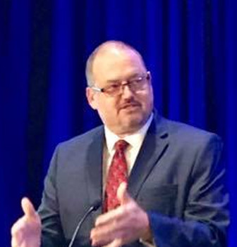 Jay Neal presenting at a conference.