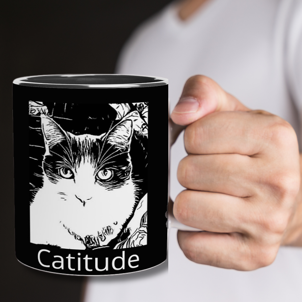 Man holds a black mug with a cat face graphic and the word Catitude on it.