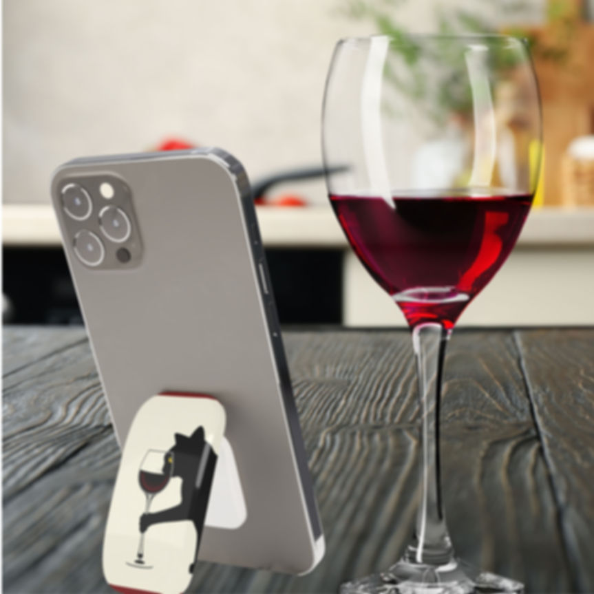 Funny Phone Grip as Cell Phone Stand Next to Glass of Wine