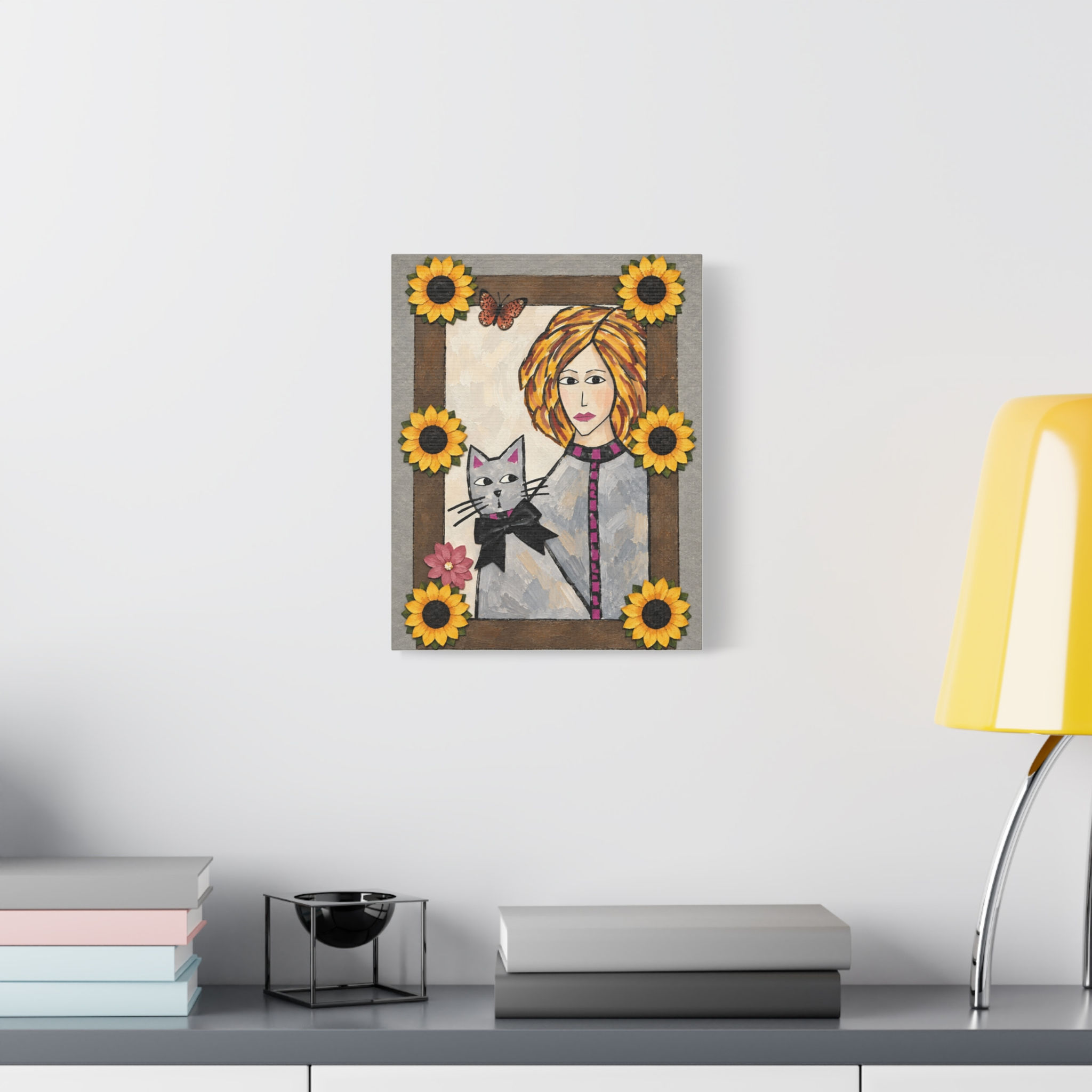 Minimalist entry way with a canvas print of a woman and her cat with flowers and a butterfly