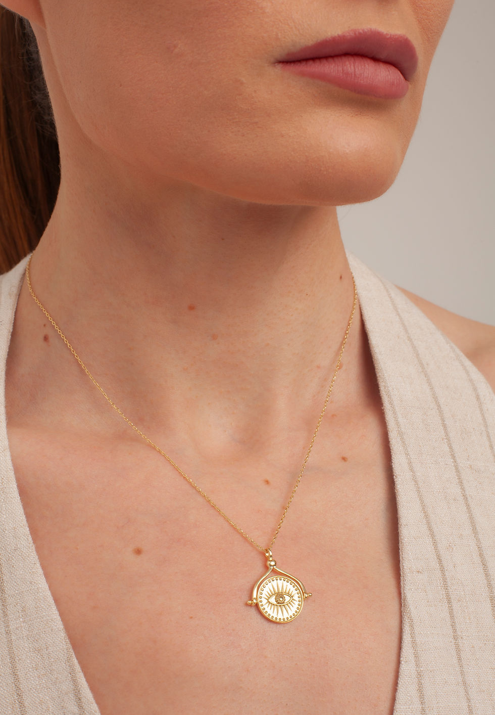 Woman wearing gold necklace and earrings