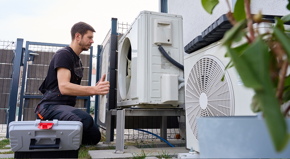 Technician servicing residential heat pump system