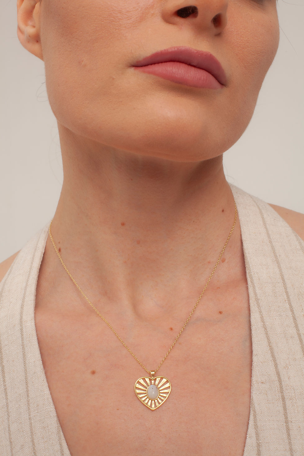 Woman wearing gold Love Moonstone Pendant necklace