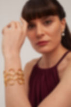 Thumbnail: Woman wearing gold Golden Loops Cuff bracelet
