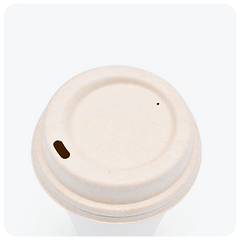 Natural color compostable lid made from sugarcane bagasse, durable plant-based fiber from Reharvest, shown fitted on a brilli