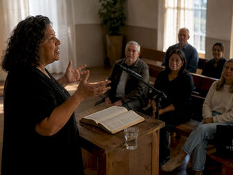 Church leader sharing testimony at pulpit