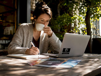 Woman researching churches at home table