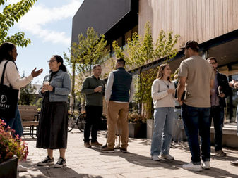 People gathering outside Tuggeranong church building