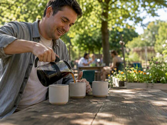 Volunteer pouring coffee for community service