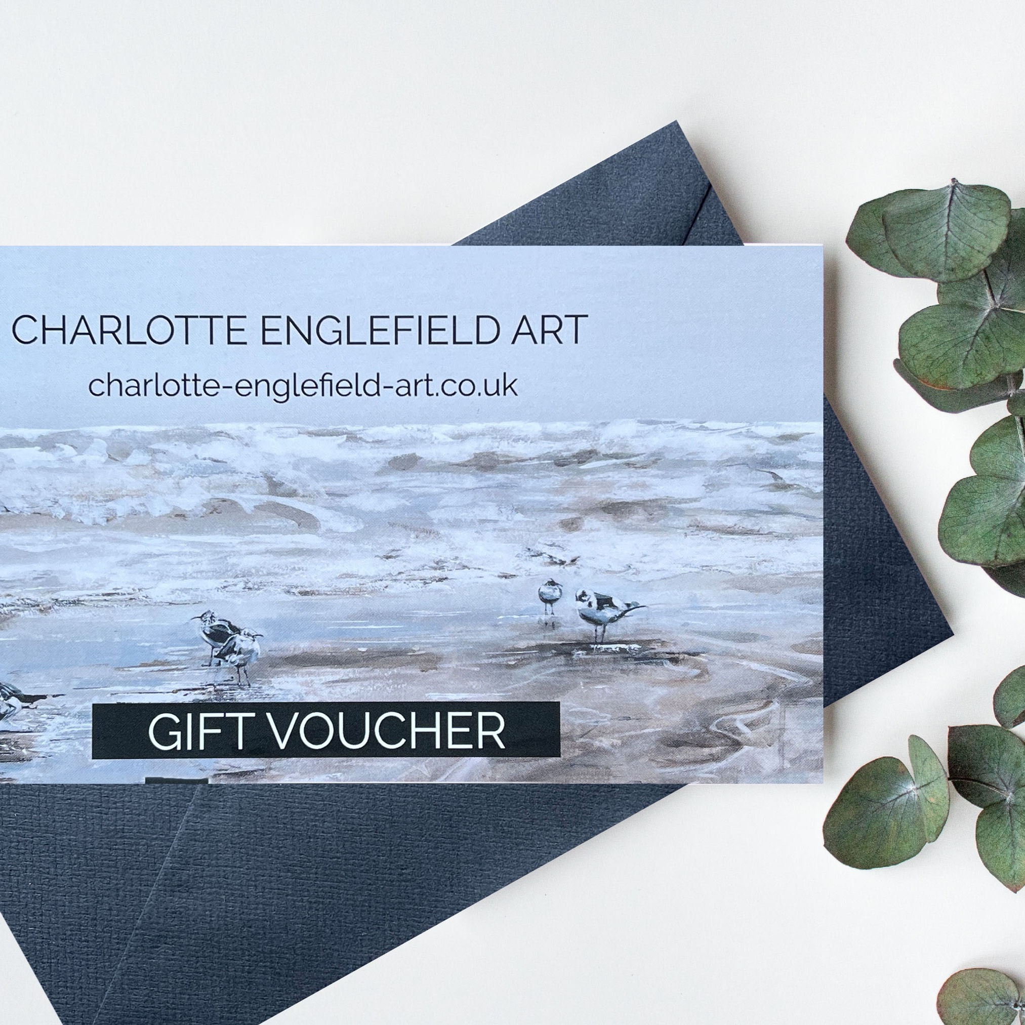 Charlotte Englefield Gift voucher on table with eucalyptus stem