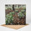 Thumbnail: Presenting New Beginnings a Snowdrop Woodland Greeting Card standing on a Kraft brown envelope