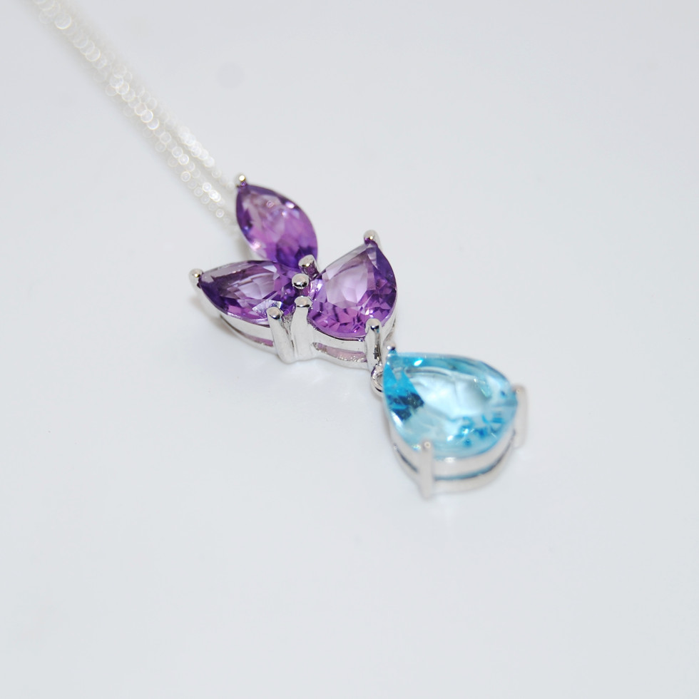 Elegant Blue Topaz and Amethyst Silver Pendant