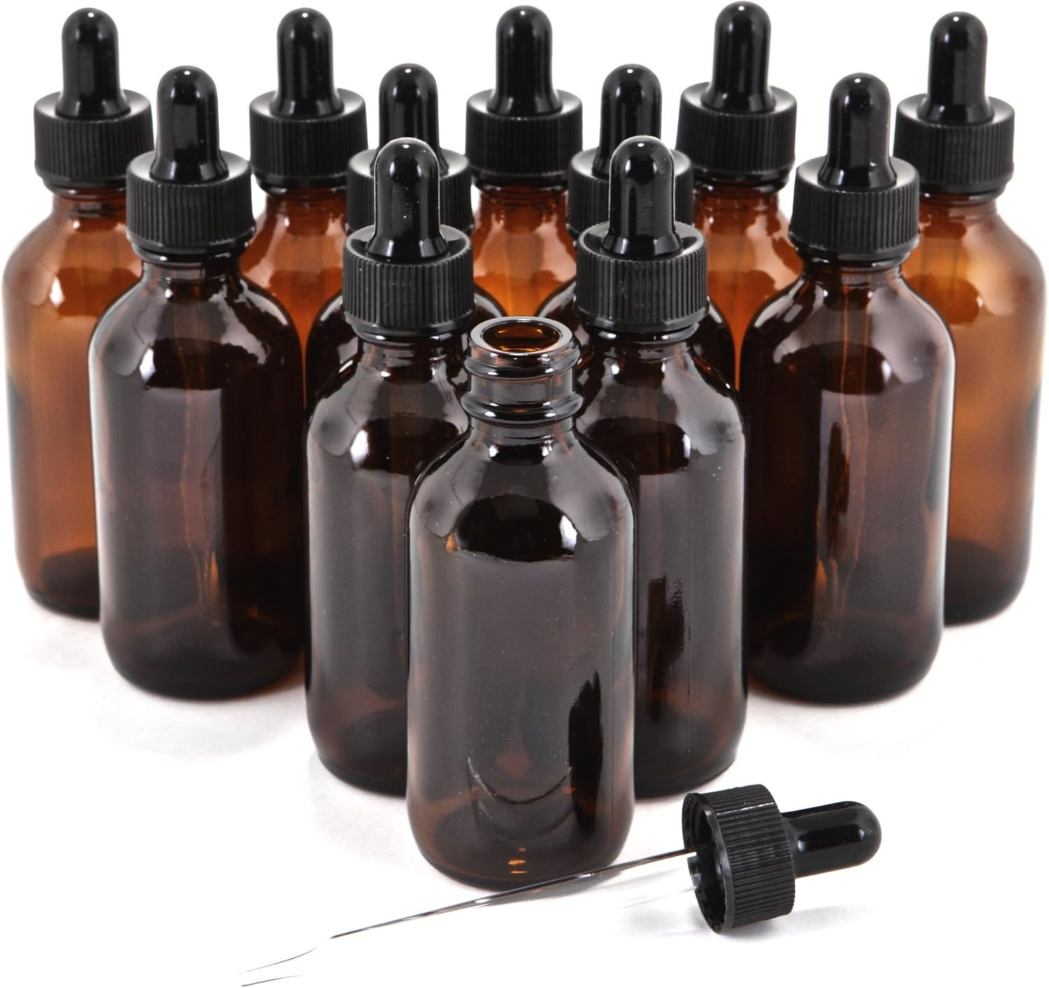 Empty 2 oz amber glass dropper bottles with graduated glass pipettes