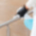 hands-with-gloves-disinfecting-hand-rail.jpg