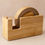 Thumbnail: Sustainable bamboo paper tape dispenser holding a roll of eco paper tape on a clean workspace left
