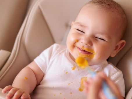 Baby eating solid food