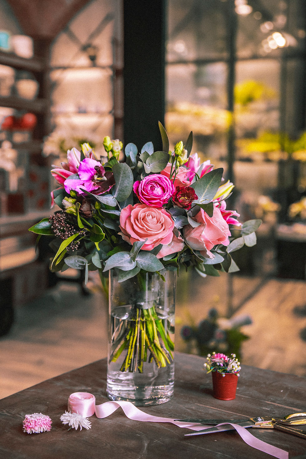 flowers-composition-mix-roses-chrysanthemums-ribbon-scissors-side-view.jpg