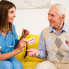 nurse-giving-old-man-his-pills.jpg
