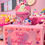 Thumbnail: CoKi dessert candle with pink cookies  and pink yellow and blue sprinkles standing on top of a dessert candle making box