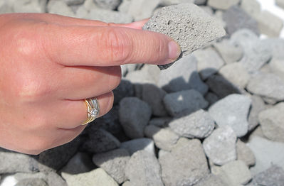 Hand holding foamed glass aggregate