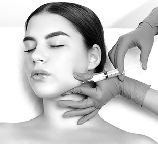 Cosmetologist makes lipolytic injections to burn fat on the chin, cheeks and neck of a wom