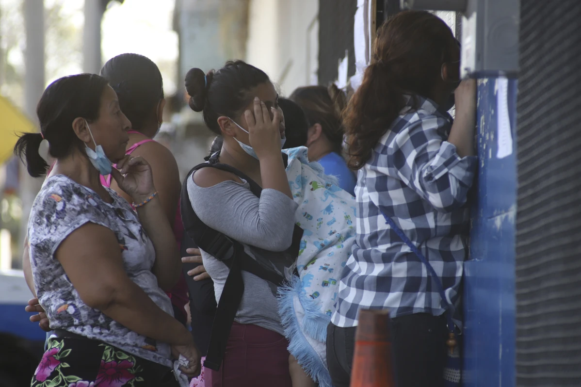 Relatives of persons who have been arrested by the police wait outside El Penalito temporary prison asking for information about their loved ones in Ciudad Delgado, El Salvador, Wednesday, April 6, 2022. During a virtual hearing in July 2023 with the Inter-American Commission on Human Rights, El Salvador’s Presidential Commissioner for Human Rights and Freedom of Expression Andrés Guzmán denied torture or violations of freedom of expression. (AP Photo/ Salvador Melendez)