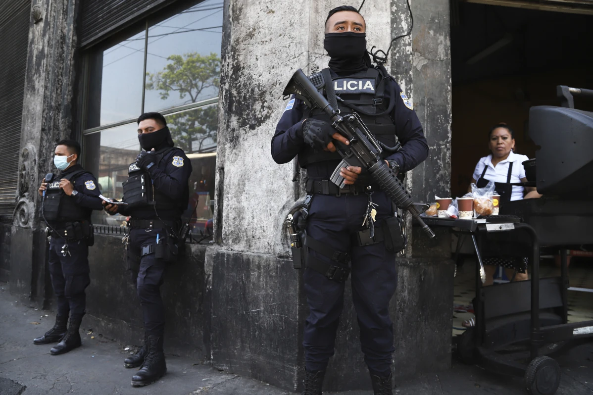 Heavily armed police guard the streets after El Salvador’s congress granted President Nayib Bukele’s request to declare a state of emergency, amid a wave of gang related killings, in downtown San Salvador, El Salvador, Sunday, March 27, 2022. The Exceptional powers still remain in effect in Nov. 2023, more then 1 and a half years after they were granted and some 72,000 arrests later. (AP Photo/ Salvador Melendez)