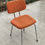 Miniature : Chaise scandinave en tissu orange et acier chromé