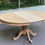 Miniature : Table à manger ronde extensible pied central art déco rénovée en bois brut 160cm
