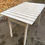 Miniature : Table de jardin blanche en bois massif pliable 4 personnes