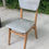 Miniature : Chaise de bureau scandinave bois massif et cuir skaï gris