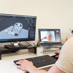 Product designer using CAD on a computer