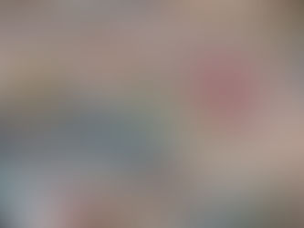 Large used car dealership lot with rows of vehicles and customers browsing