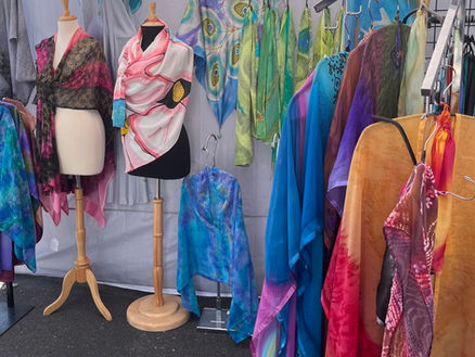 A colorful display of Joy Hand Painted Silks