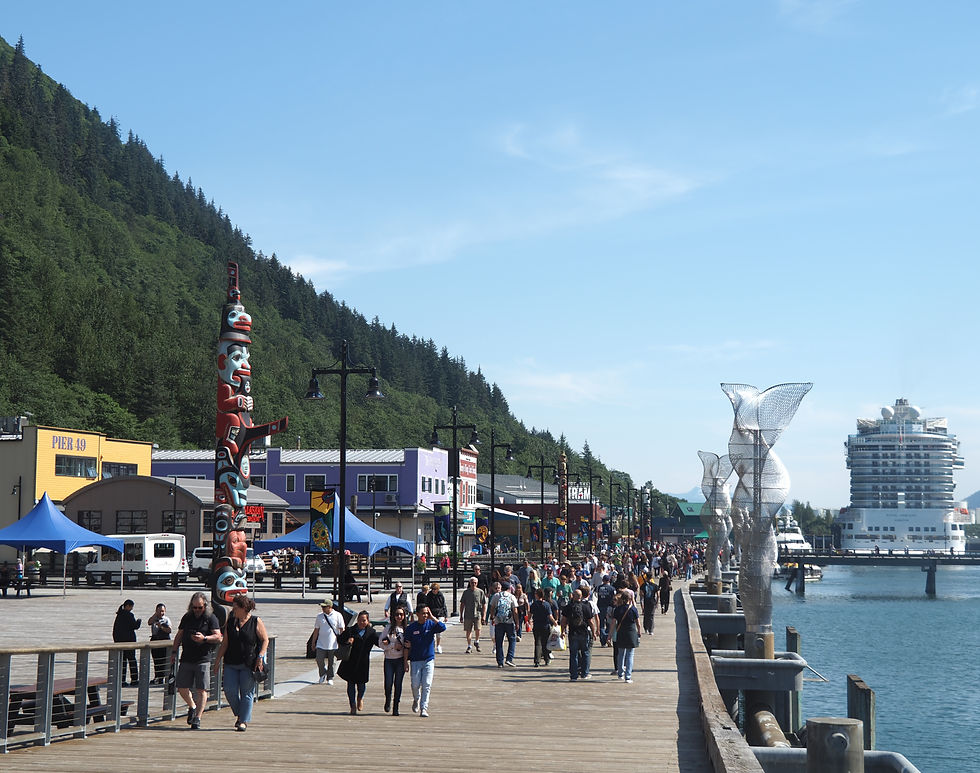 Cruise ship passengers walk the Juneau Seawalk on July 28, 2025. (Natalie Buttner / Juneau Independent)