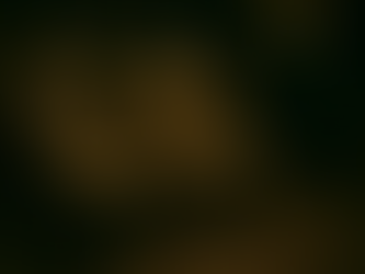 Three figures covered in a wax-like substance sit on chairs in a dimly lit room, under a single light bulb, creating an eerie atmosphere.