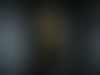 Hallway with open door revealing a dimly lit room, mattress on floor, and bloodstain on wall. Surveillance camera overlay displays date and time.