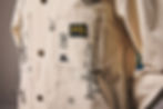  A close-up of a custom hand-painted work jacket featuring an original illustration by boneBLACK Denver.