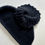 Thumbnail: Black knit wool cape front view