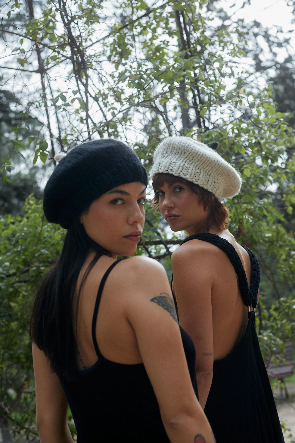 Thumbnail: two women wearing off-white wool beret back view