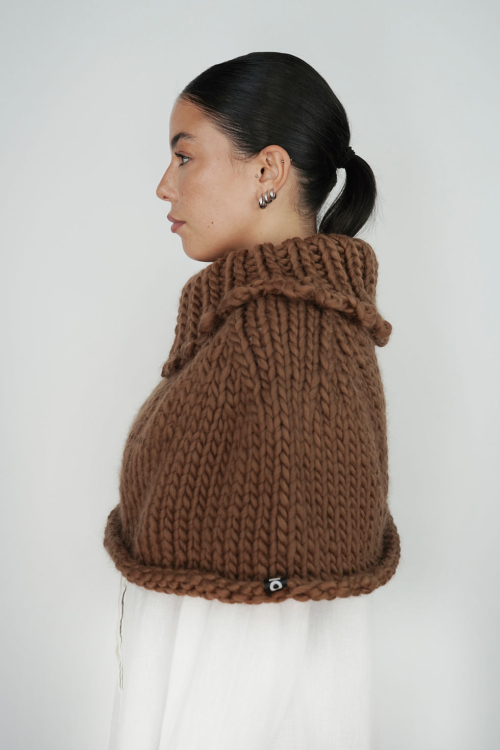 Thumbnail: Brown knit wool cape side view