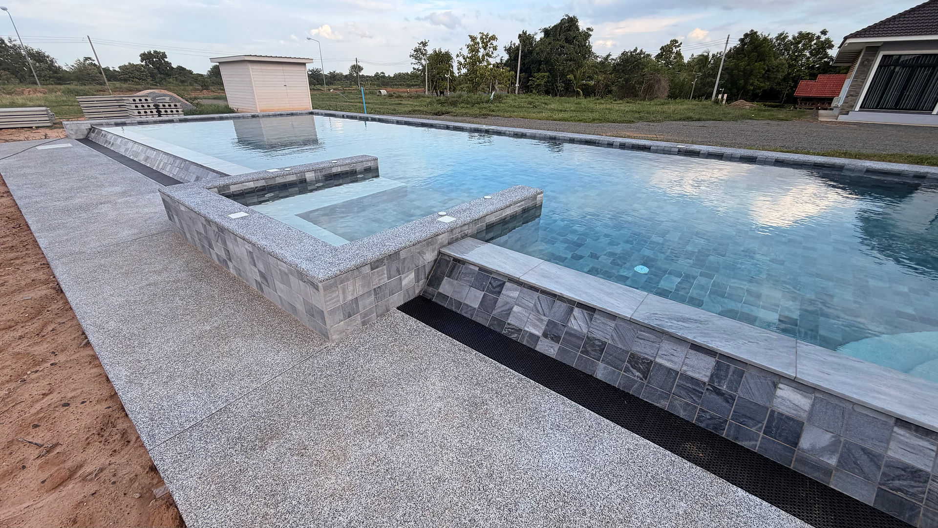 Balance tank and water-control system for an overflow swimming pool