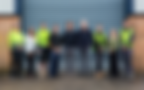 Team of 9 people, some in high-visibility workwear