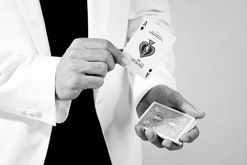 Felix Riba, professional Pittsburgh magician, showcasing his card magic skills, perfect for unforgettable wedding entertainment.