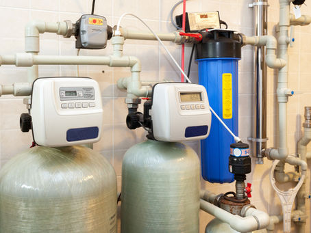 Commercial water softener system with dual tanks and digital controls.