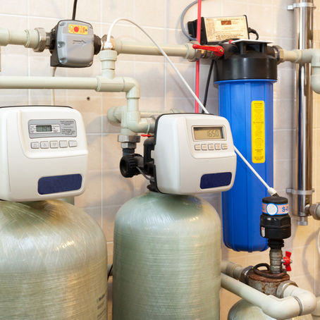 Commercial water softener system with dual tanks and digital controls.