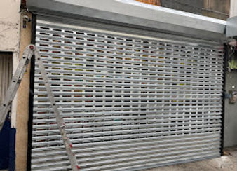 store front gate installation