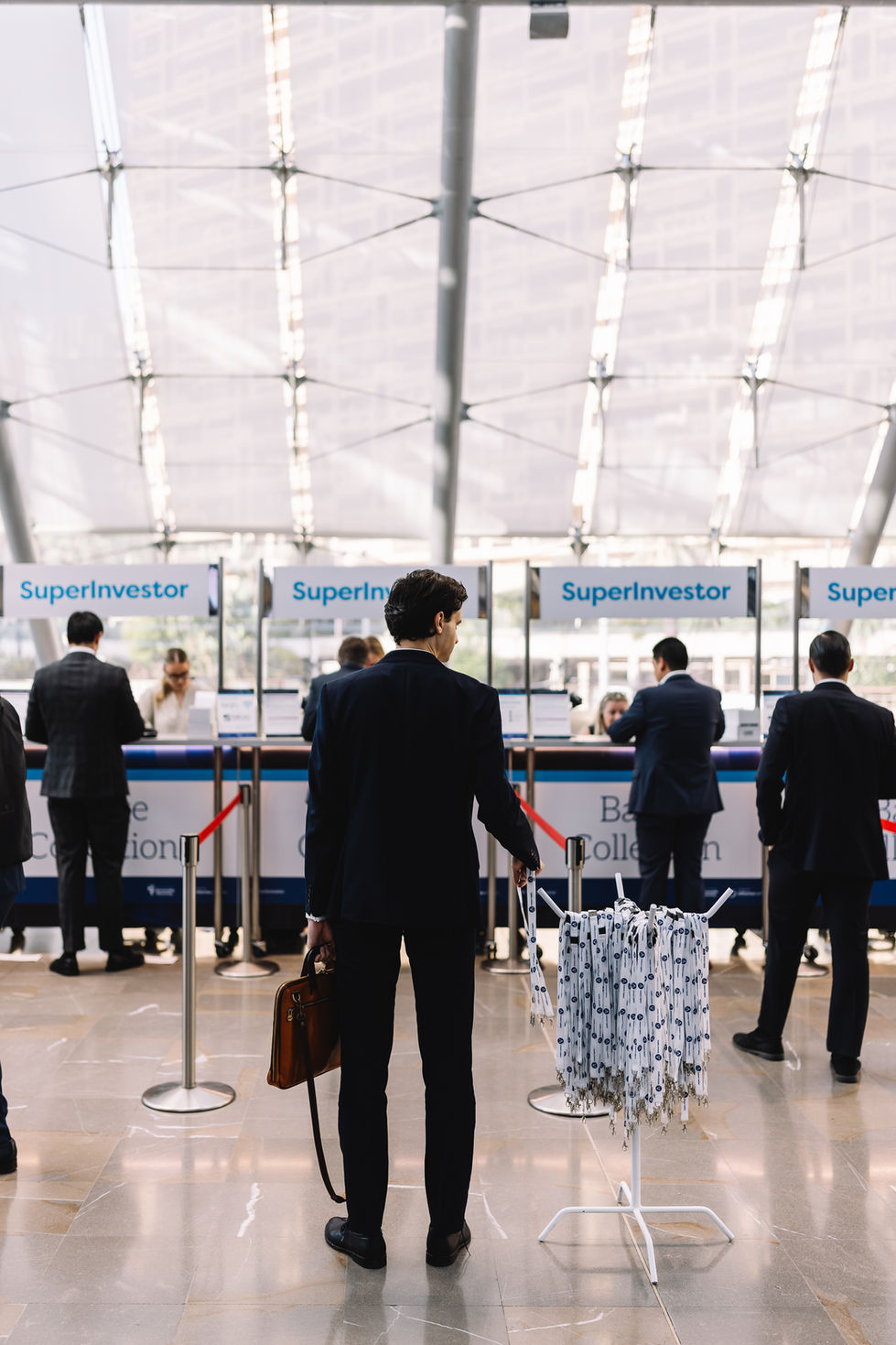 Event photography showcasing business professionals networking and engaging at the Super Investor conference in Monaco, set against a backdrop of elegant venues and vibrant interactions. Portugal Photographers, Rokas Photography, a worldwide photography company.
