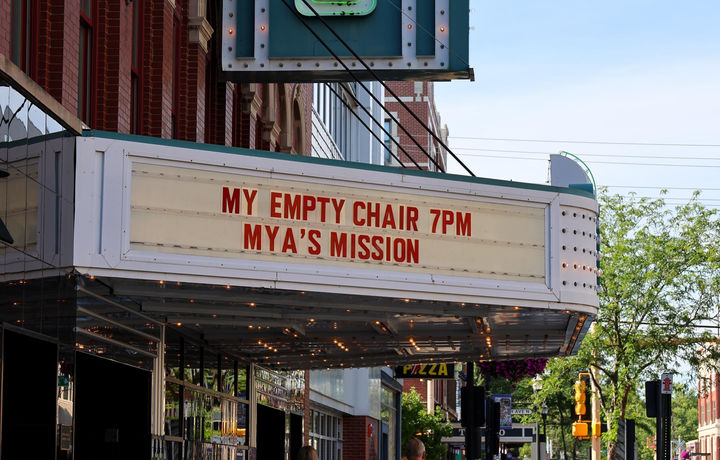 Fargo Theater with "My Empty Chair at 7pm Mya's Mission" on the marquee